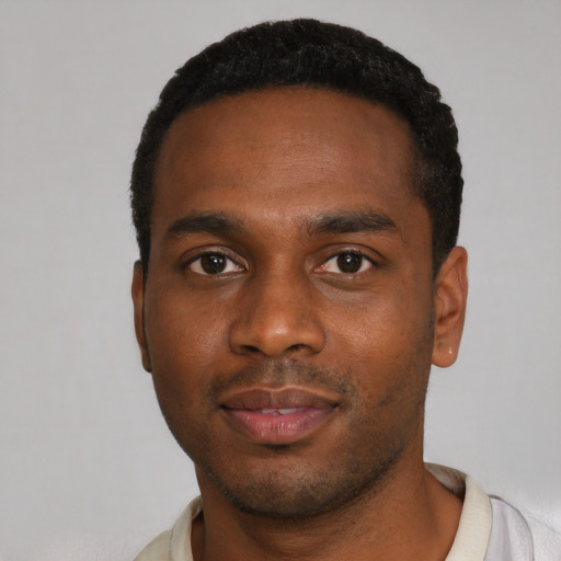 Neutral black young-adult male with short  black hair and brown eyes
