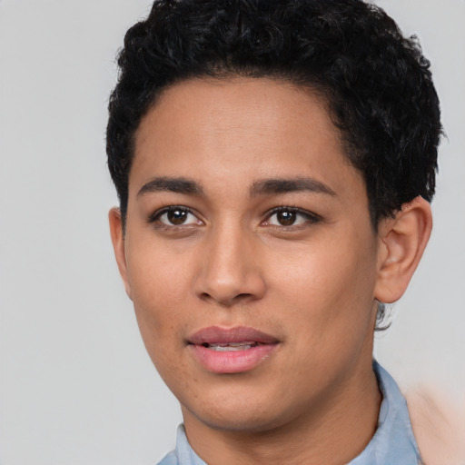 Joyful latino young-adult female with short  black hair and brown eyes