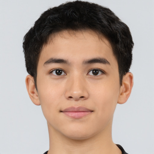 Joyful latino young-adult male with short  brown hair and brown eyes