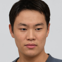 Neutral asian young-adult male with short  brown hair and brown eyes