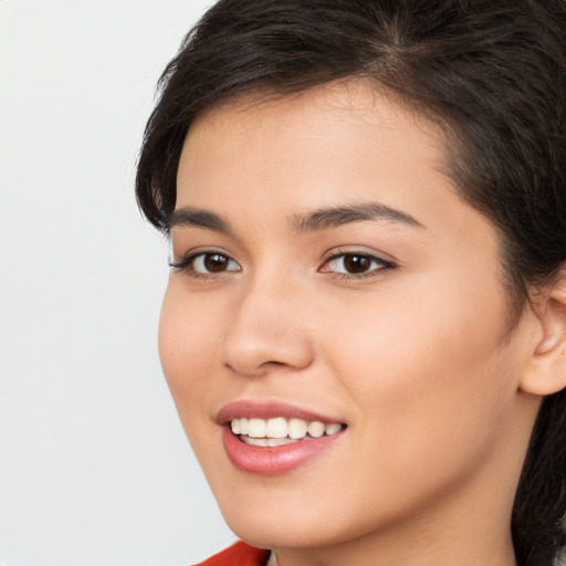 Joyful white young-adult female with long  brown hair and brown eyes