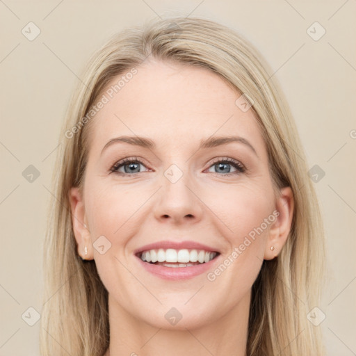 Joyful white young-adult female with long  brown hair and blue eyes