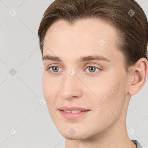 Joyful white young-adult female with short  brown hair and grey eyes