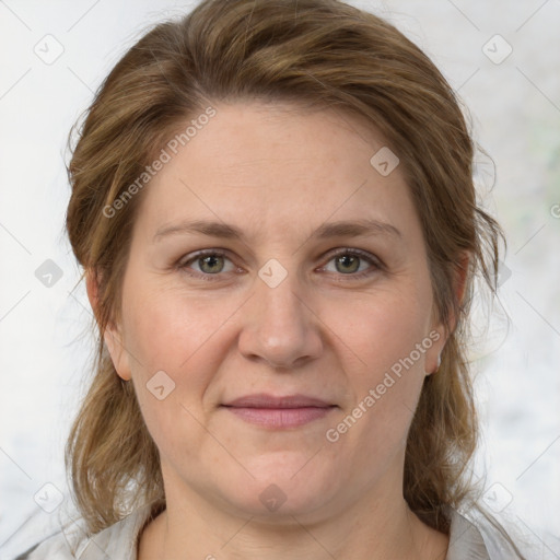 Joyful white adult female with medium  brown hair and grey eyes