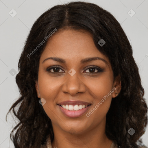 Joyful black young-adult female with long  brown hair and brown eyes