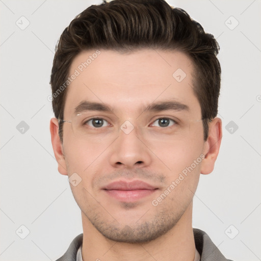 Joyful white young-adult male with short  brown hair and brown eyes