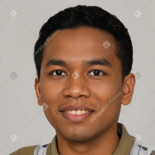 Joyful black young-adult male with short  black hair and brown eyes