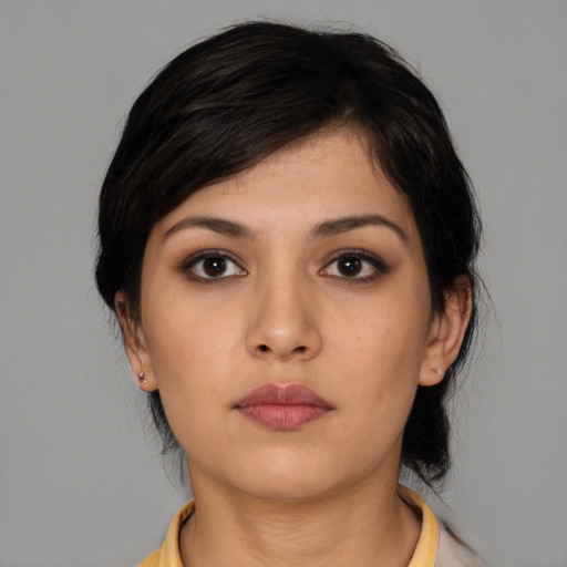 Neutral white young-adult female with medium  black hair and brown eyes