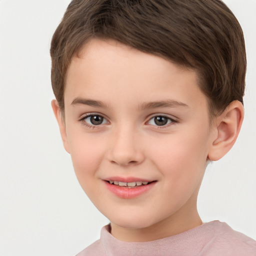 Joyful white child female with short  brown hair and brown eyes