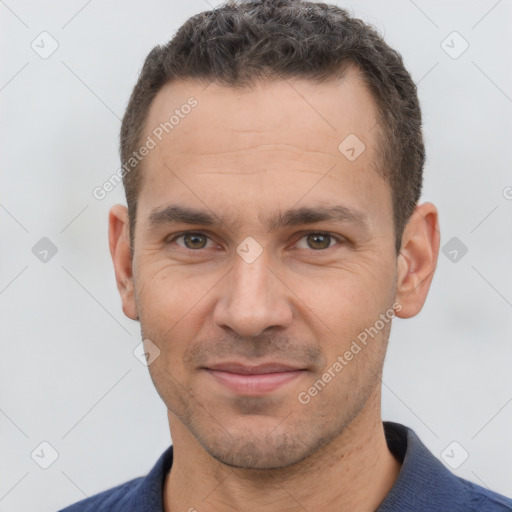 Joyful white adult male with short  brown hair and brown eyes