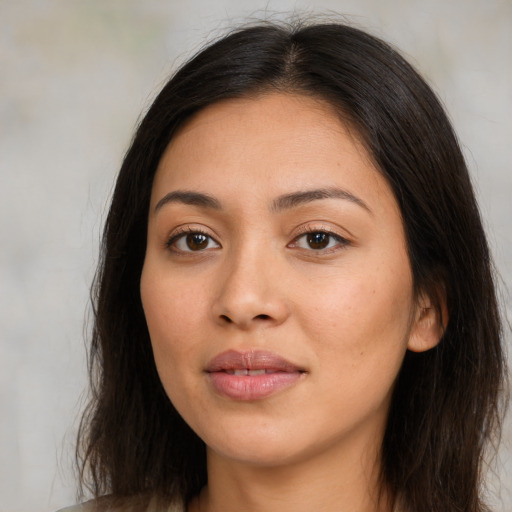 Joyful asian young-adult female with long  brown hair and brown eyes