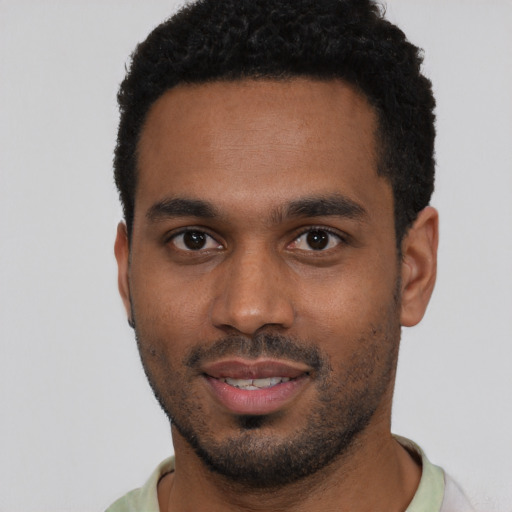Neutral black young-adult male with short  black hair and brown eyes