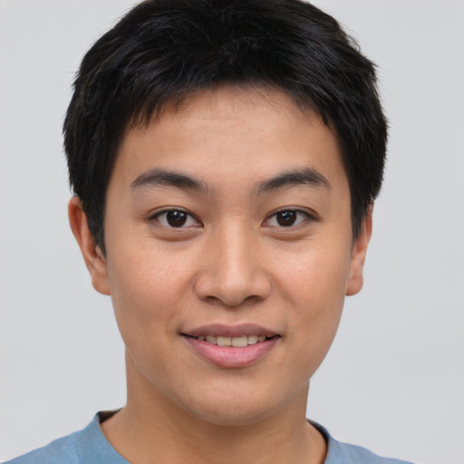 Joyful asian young-adult male with short  brown hair and brown eyes