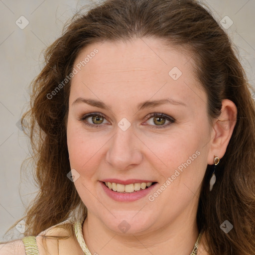 Joyful white young-adult female with long  brown hair and green eyes