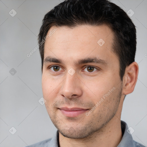 Joyful white young-adult male with short  brown hair and brown eyes