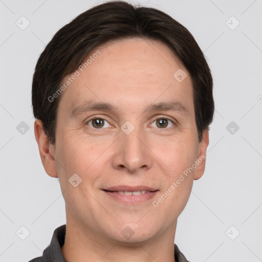 Joyful white adult male with short  brown hair and grey eyes