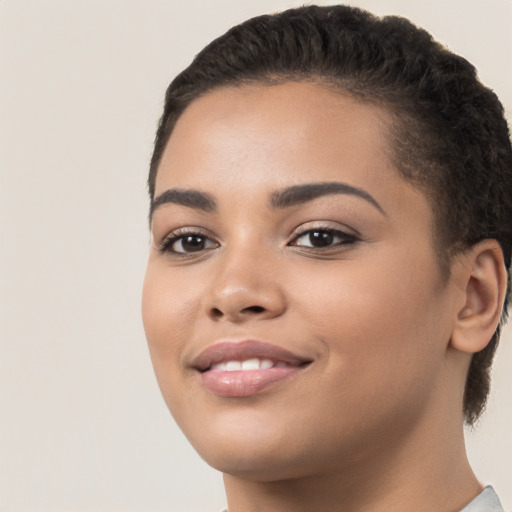 Joyful latino young-adult female with short  brown hair and brown eyes