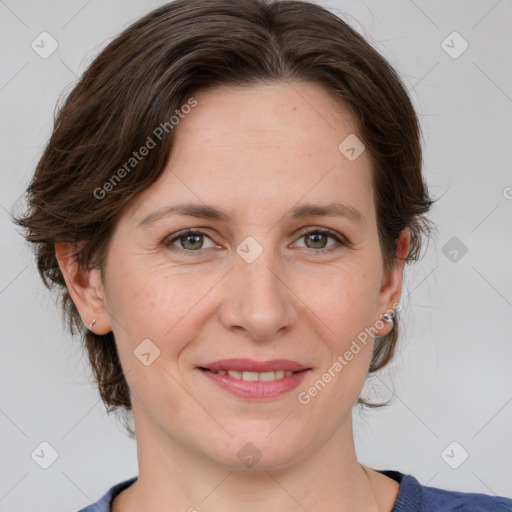 Joyful white adult female with medium  brown hair and grey eyes