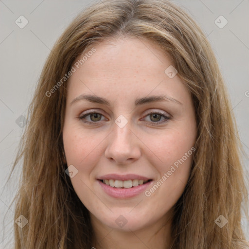 Joyful white young-adult female with long  brown hair and green eyes