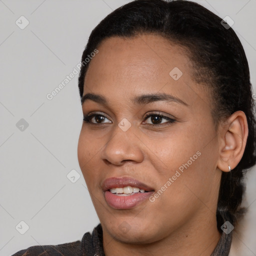 Joyful black young-adult female with short  black hair and brown eyes