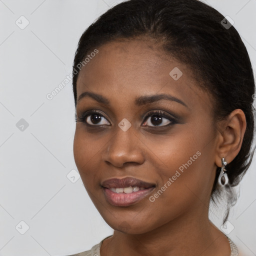 Joyful black young-adult female with medium  black hair and brown eyes