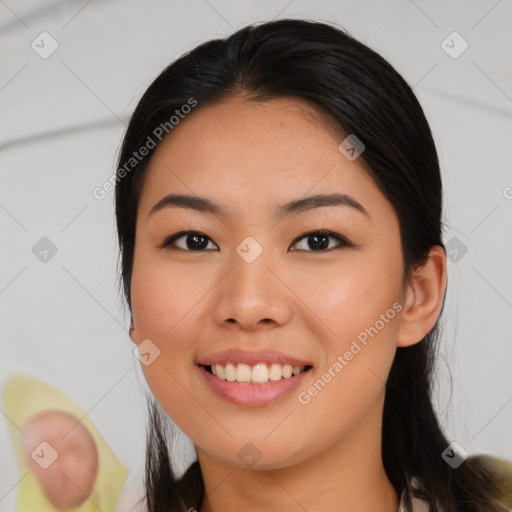 Joyful asian young-adult female with medium  black hair and brown eyes