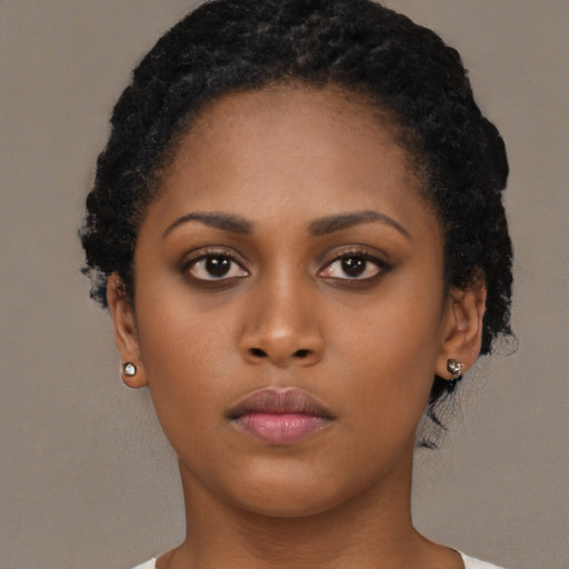 Neutral black young-adult female with short  brown hair and brown eyes