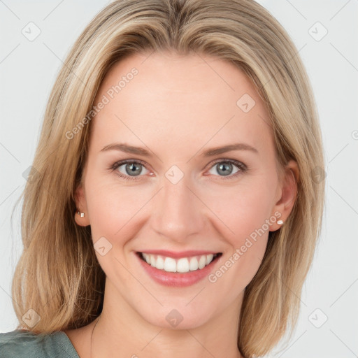 Joyful white young-adult female with medium  brown hair and blue eyes