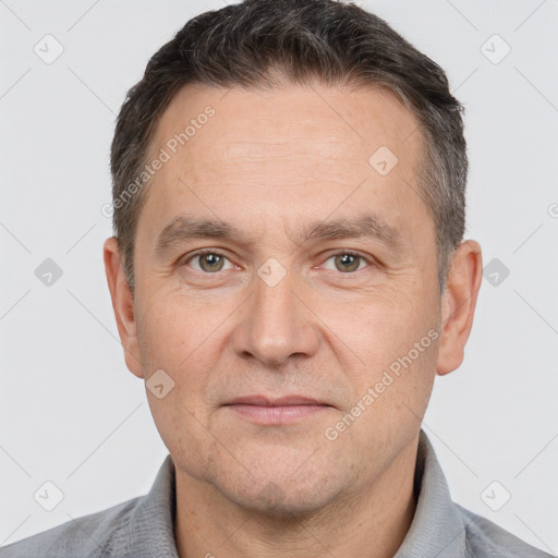 Joyful white adult male with short  brown hair and brown eyes