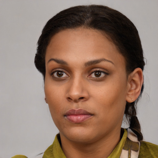 Neutral black young-adult female with medium  brown hair and brown eyes