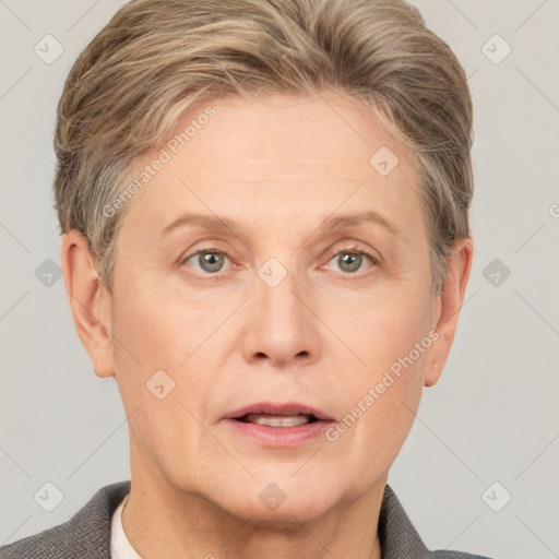 Joyful white adult female with short  brown hair and grey eyes