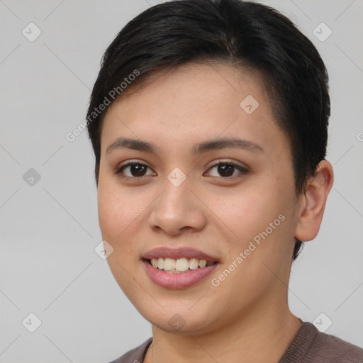 Joyful asian young-adult female with short  brown hair and brown eyes