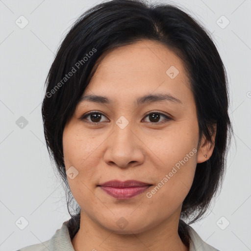 Joyful asian young-adult female with medium  brown hair and brown eyes