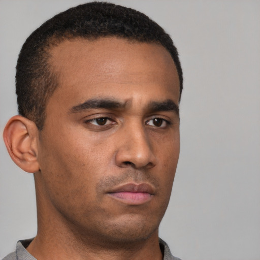 Neutral latino young-adult male with short  brown hair and brown eyes