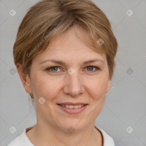 Joyful white adult female with short  brown hair and grey eyes