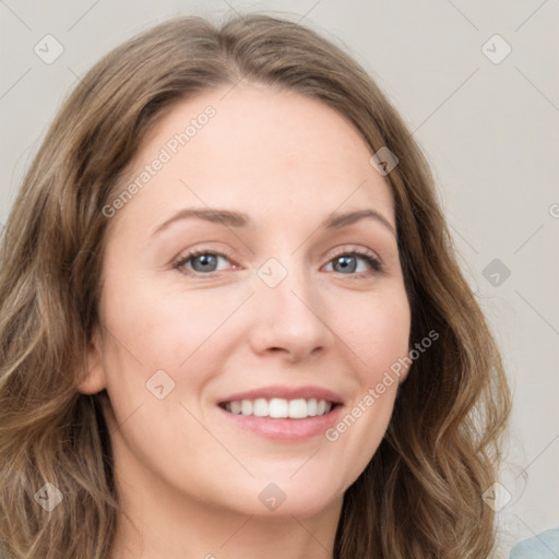 Joyful white young-adult female with long  brown hair and green eyes