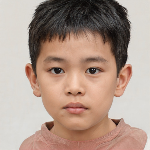 Neutral asian child male with short  brown hair and brown eyes
