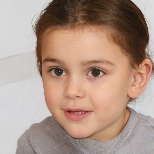 Joyful white child female with short  brown hair and brown eyes