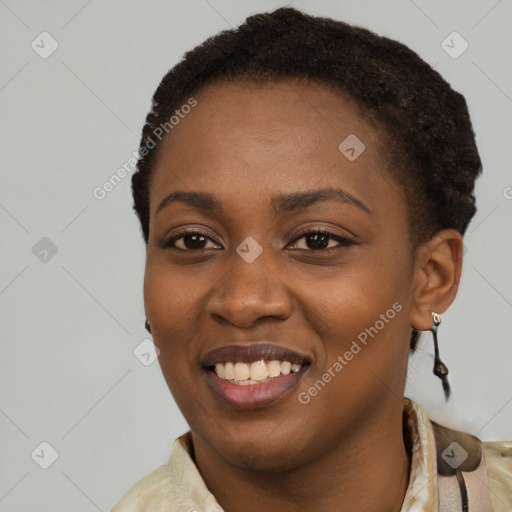 Joyful black young-adult female with short  black hair and brown eyes