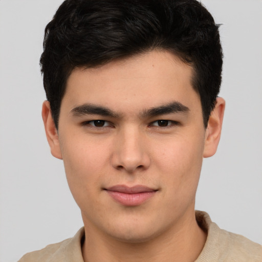 Joyful asian young-adult male with short  brown hair and brown eyes
