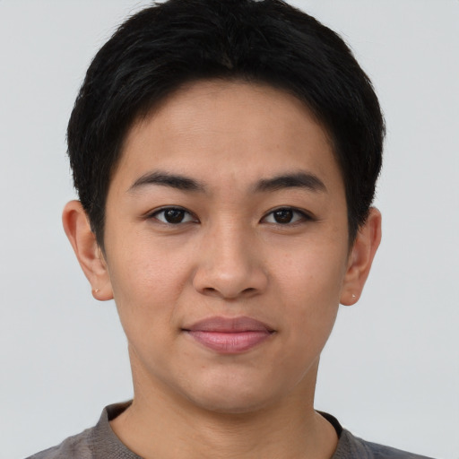Joyful asian young-adult female with short  brown hair and brown eyes