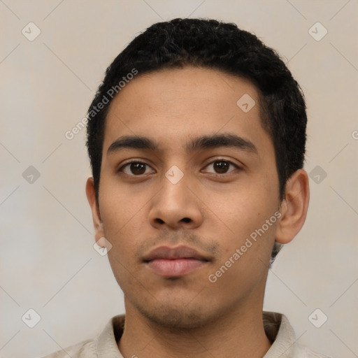 Neutral latino young-adult male with short  black hair and brown eyes