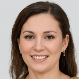 Joyful white young-adult female with medium  brown hair and grey eyes