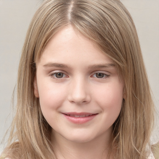 Joyful white child female with long  brown hair and brown eyes