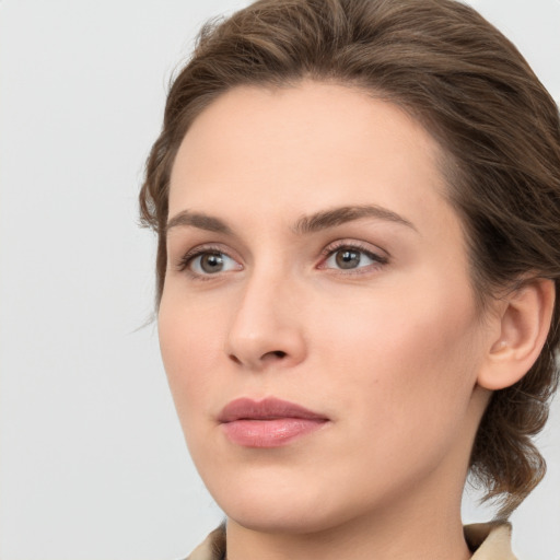 Neutral white young-adult female with medium  brown hair and grey eyes