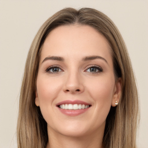 Joyful white young-adult female with long  brown hair and brown eyes