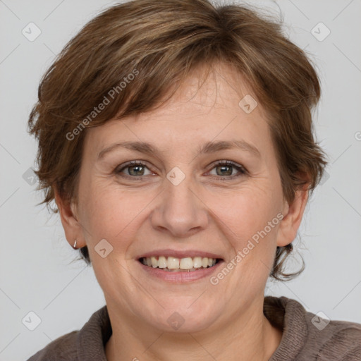 Joyful white adult female with medium  brown hair and grey eyes