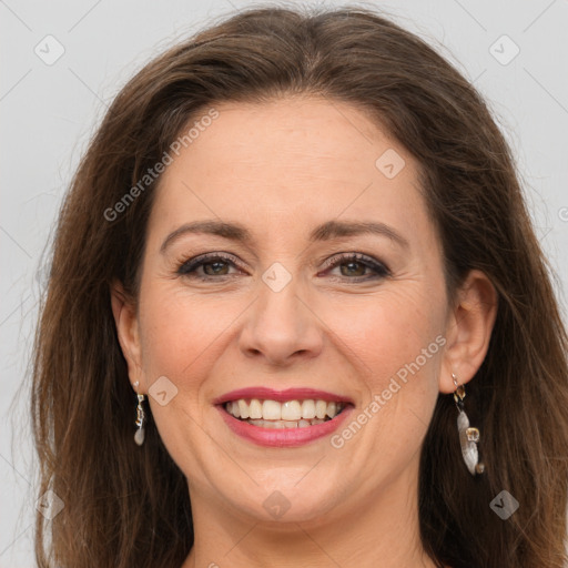 Joyful white adult female with long  brown hair and grey eyes