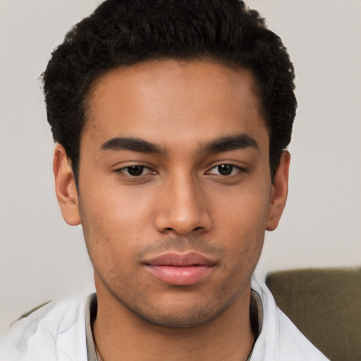 Neutral latino young-adult male with short  brown hair and brown eyes