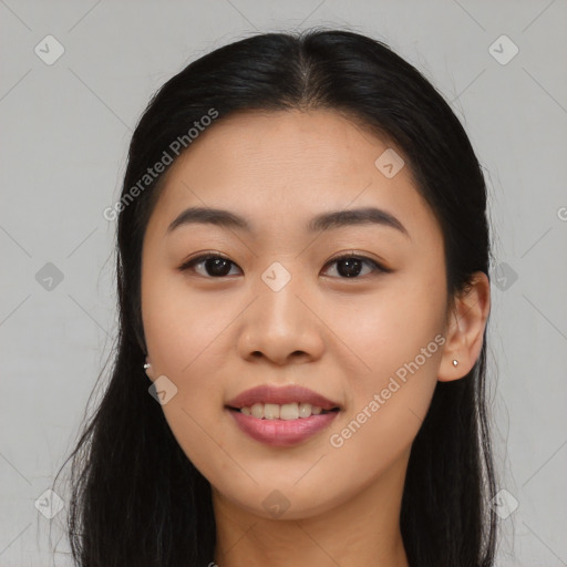 Joyful asian young-adult female with long  brown hair and brown eyes